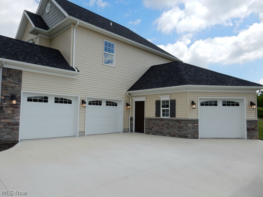 7623 Rimrock Road Medina, OH 44256 - Photo 2 of 20 3 Car Garage With Drains and Hot and Cold Water!