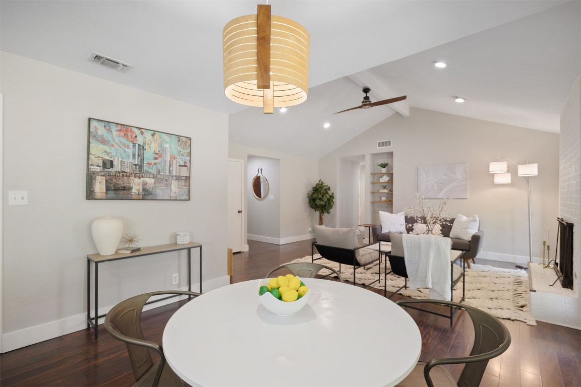 9228 Partridge Circle Austin, TX 78758 - Photo 16 of 36 a view of a dining room with furniture a chandelier and wooden floor