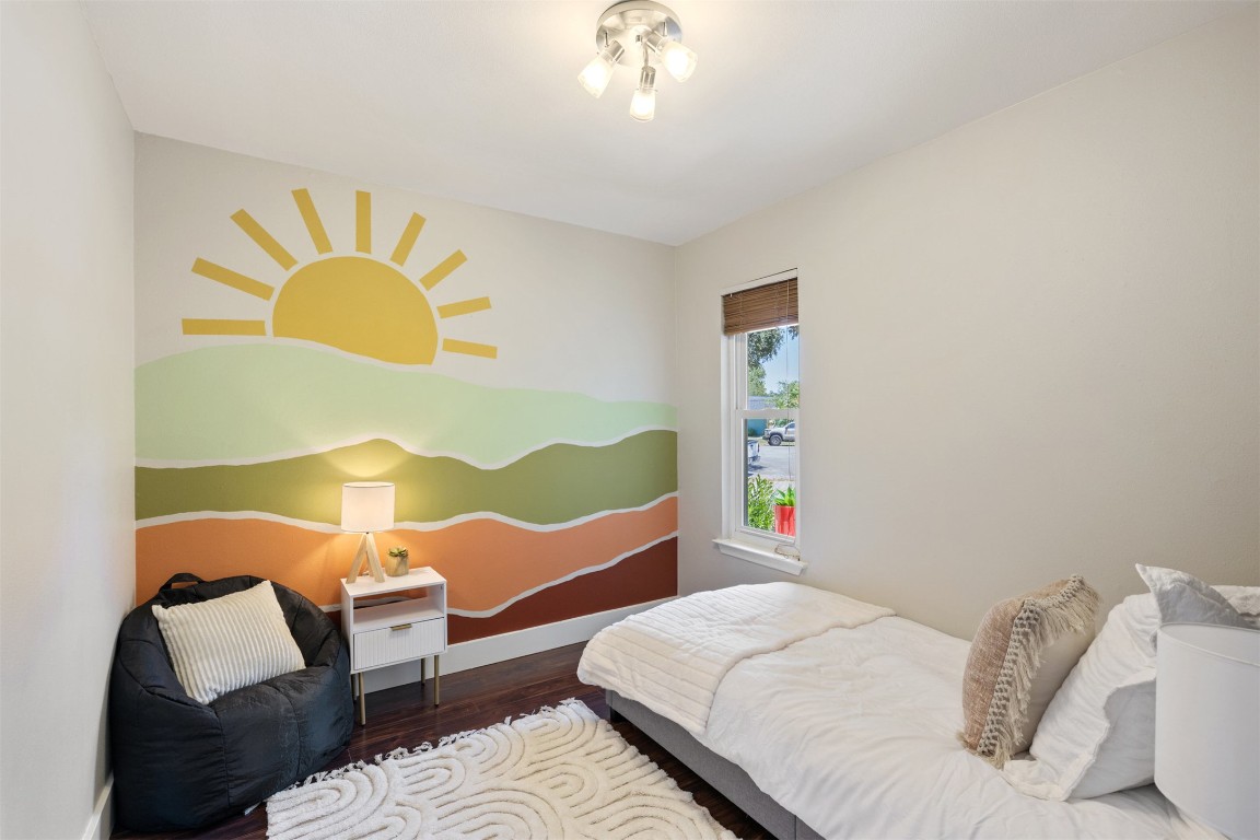 9228 Partridge Circle Austin, TX 78758 - Photo 27 of 36 a bed room with a bed and painting on the wall