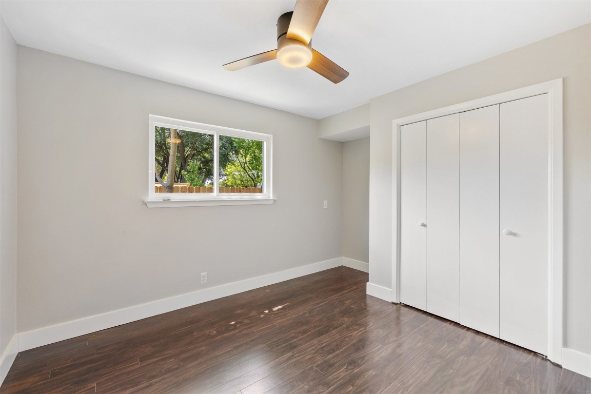 9228 Partridge Circle Austin, TX 78758 - Photo 29 of 36 a view of an empty room with wooden floor and a window