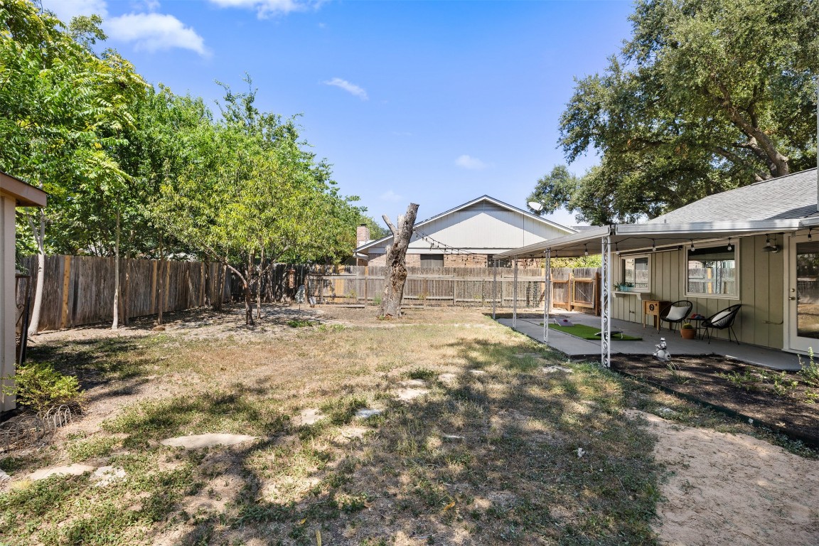 9228 Partridge Circle Austin, TX 78758 - Photo 36 of 36 a backyard of a house with table and chairs