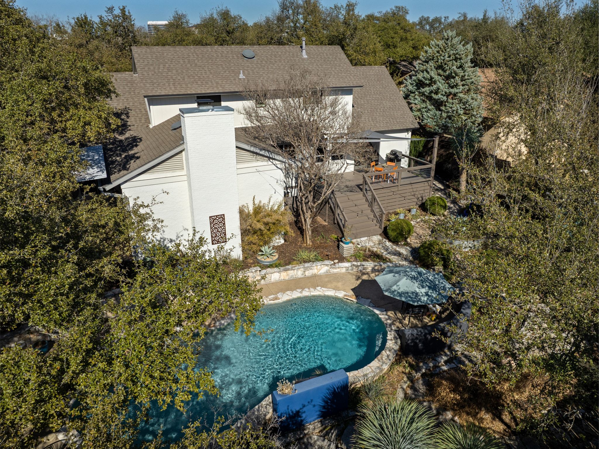 4503 Mountain Path Drive Austin, TX 78759 - Photo 34 of 36 Bird's eye view of a tree filled landscape and pool