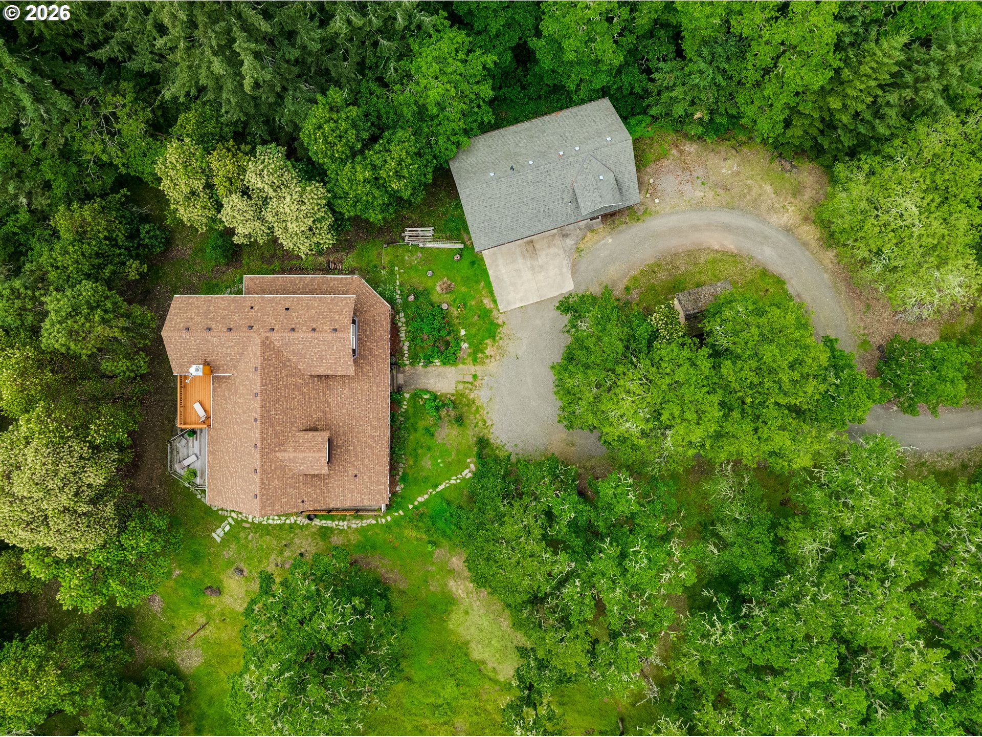 28544 Crow Road Eugene, OR 97402 - Photo 45 of 48 an aerial view of a house with a garden and covered with trees