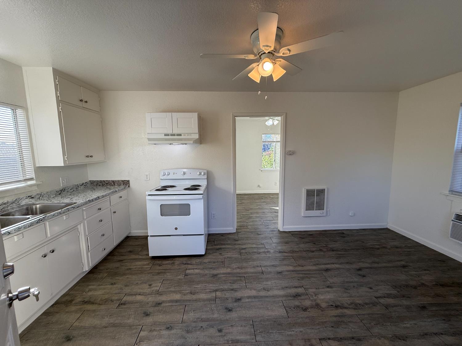 13229 Le Grand Road Le Grand, CA 95333 - Photo 5 of 8 a kitchen with a stove cabinets and a sink