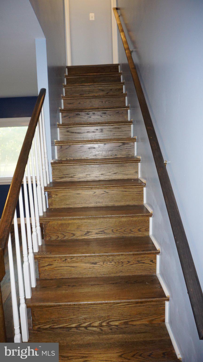 5854 Deale Churchton Road Deale, MD 20751 - Photo 29 of 57 Elegant wooden staircase leading up.