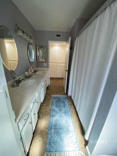 218 South Lilac Street Ridgecrest, CA 93555 - Photo 23 of 43 a bathroom with sink and mirror
