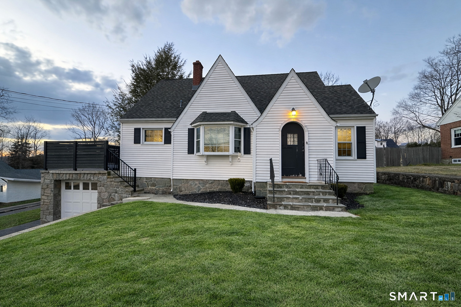 483 Charles Street Torrington, CT 06790 - Photo 1 of 40 a front view of a house with a garden
