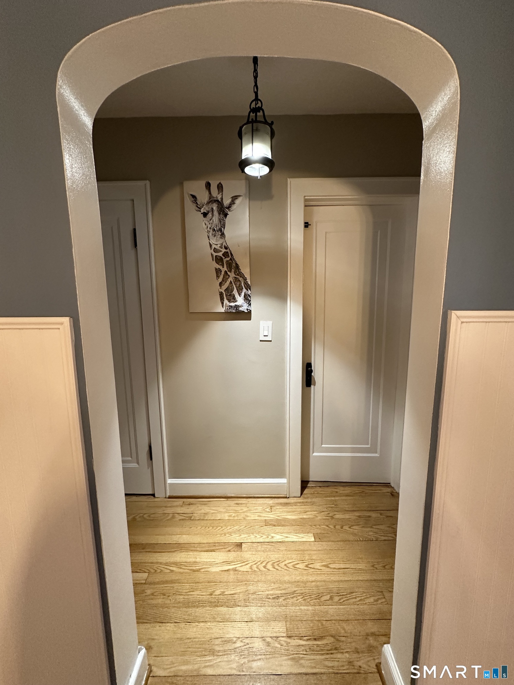 483 Charles Street Torrington, CT 06790 - Photo 12 of 40 a view of a livingroom from a hallway