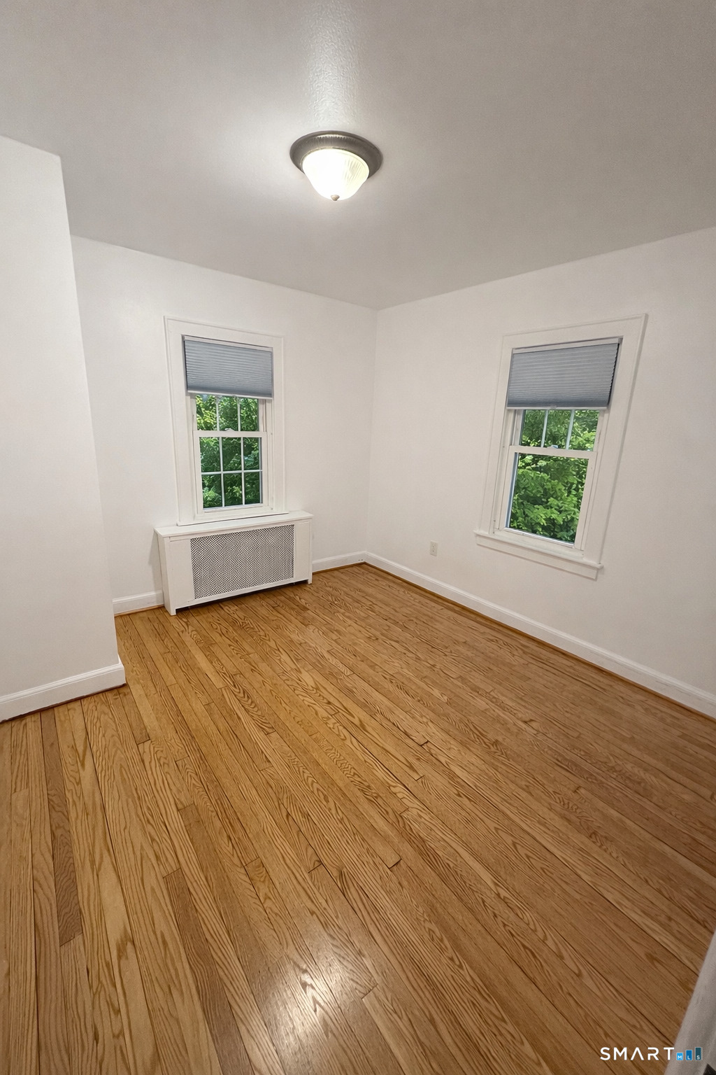 483 Charles Street Torrington, CT 06790 - Photo 14 of 40 an empty room with windows