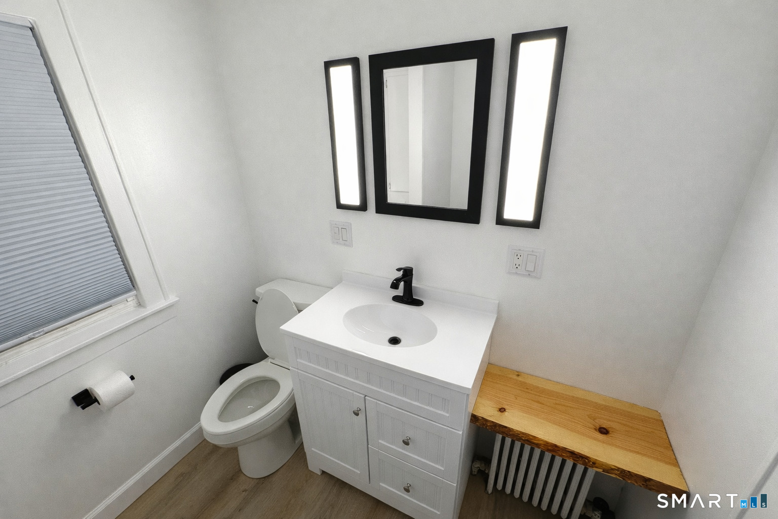 483 Charles Street Torrington, CT 06790 - Photo 15 of 40 a bathroom with a sink mirror and toilet