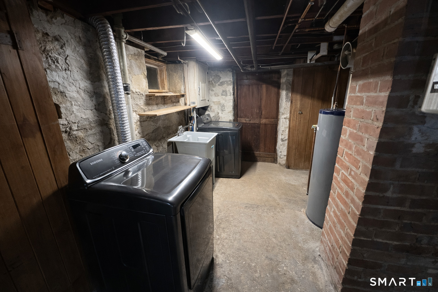 483 Charles Street Torrington, CT 06790 - Photo 27 of 40 a utility room with dryer and washer