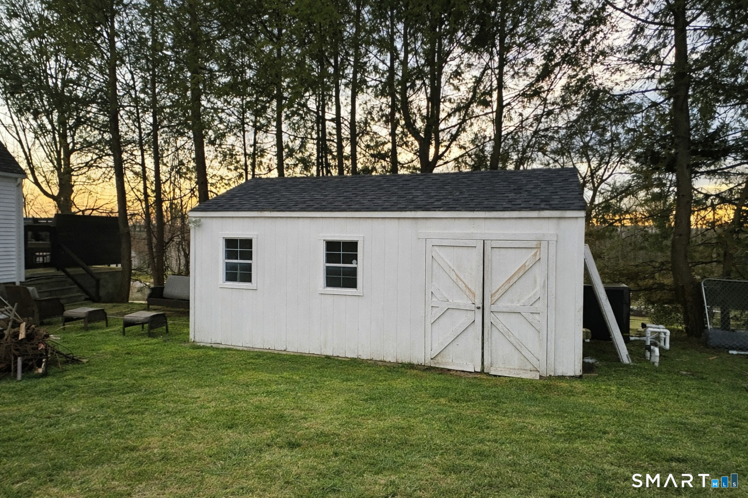 483 Charles Street Torrington, CT 06790 - Photo 35 of 40 a backyard of a house with table and chairs