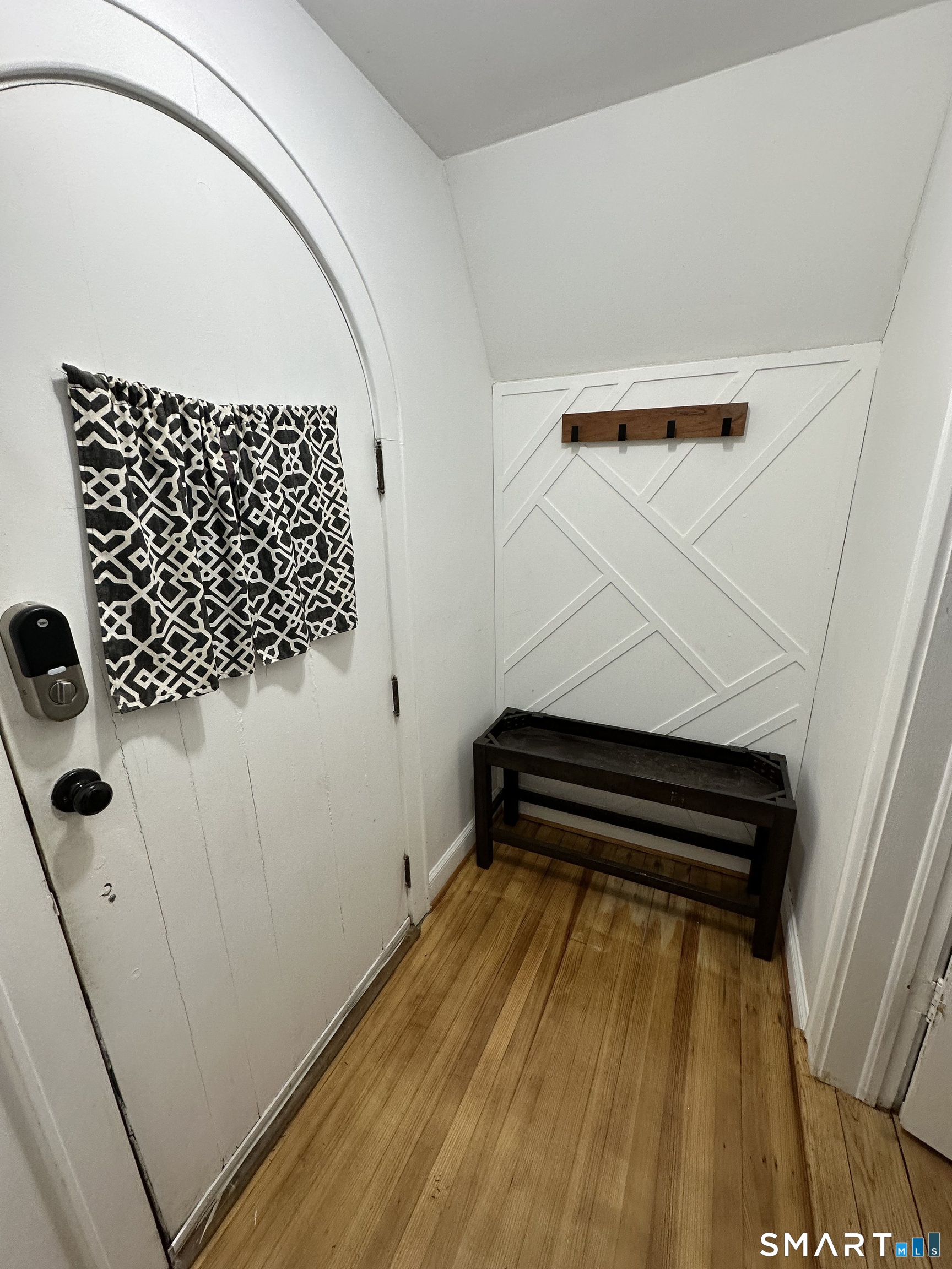 483 Charles Street Torrington, CT 06790 - Photo 4 of 40 a view of a closet with wooden floor