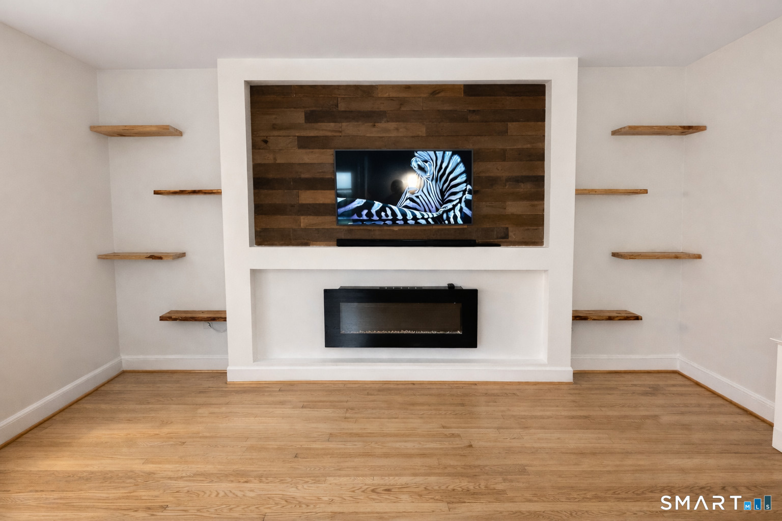 483 Charles Street Torrington, CT 06790 - Photo 5 of 40 a living room with a fireplace