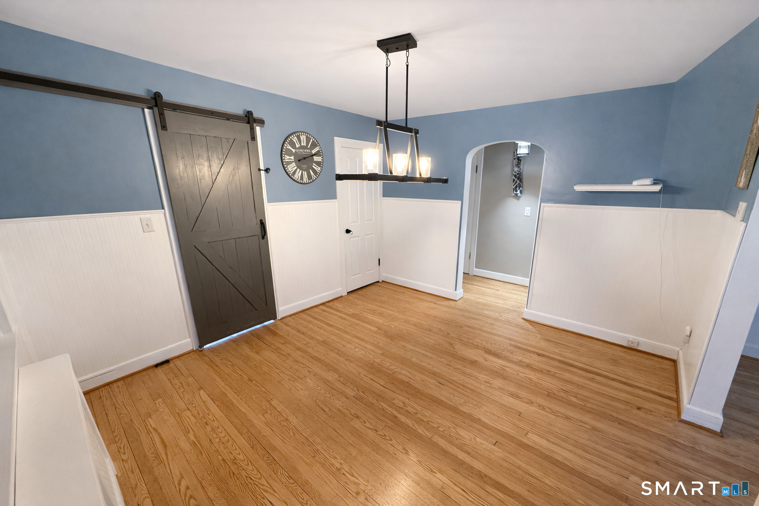 483 Charles Street Torrington, CT 06790 - Photo 8 of 40 a view of a kitchen with a sink and wooden floor