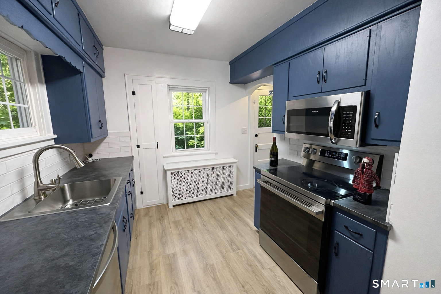 483 Charles Street Torrington, CT 06790 - Photo 9 of 40 a kitchen with a sink appliances and cabinets