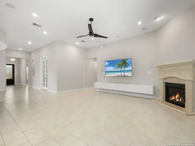 a view of an empty room and fire place