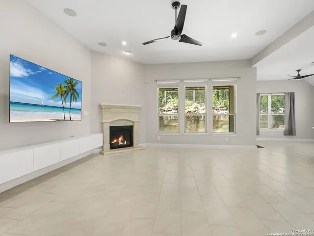 a view of an empty room with a fireplace