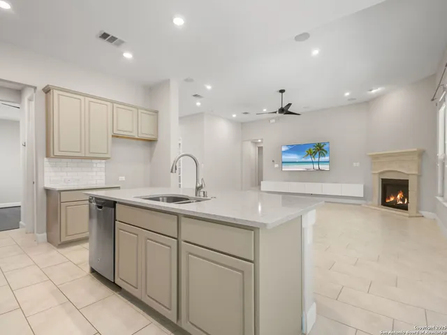 a kitchen with a sink and a refrigerator