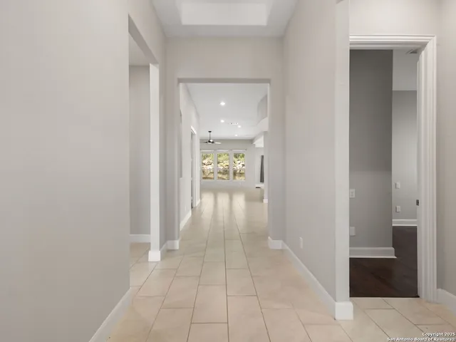 wooden floor in a hall with an entryway