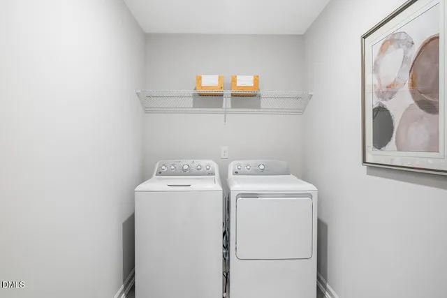 a bedroom with a bed and a dresser next to a window