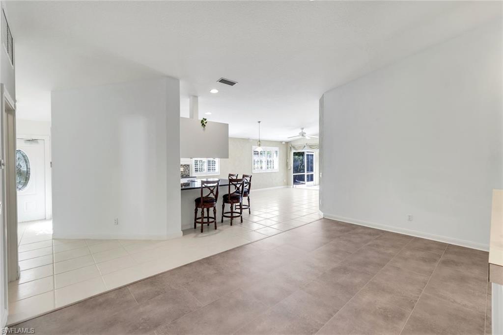 3025 Futuna Lane Naples, FL 34119 - Photo 14 of 46 Unfurnished room featuring a ceiling fan and light tile patterned floors