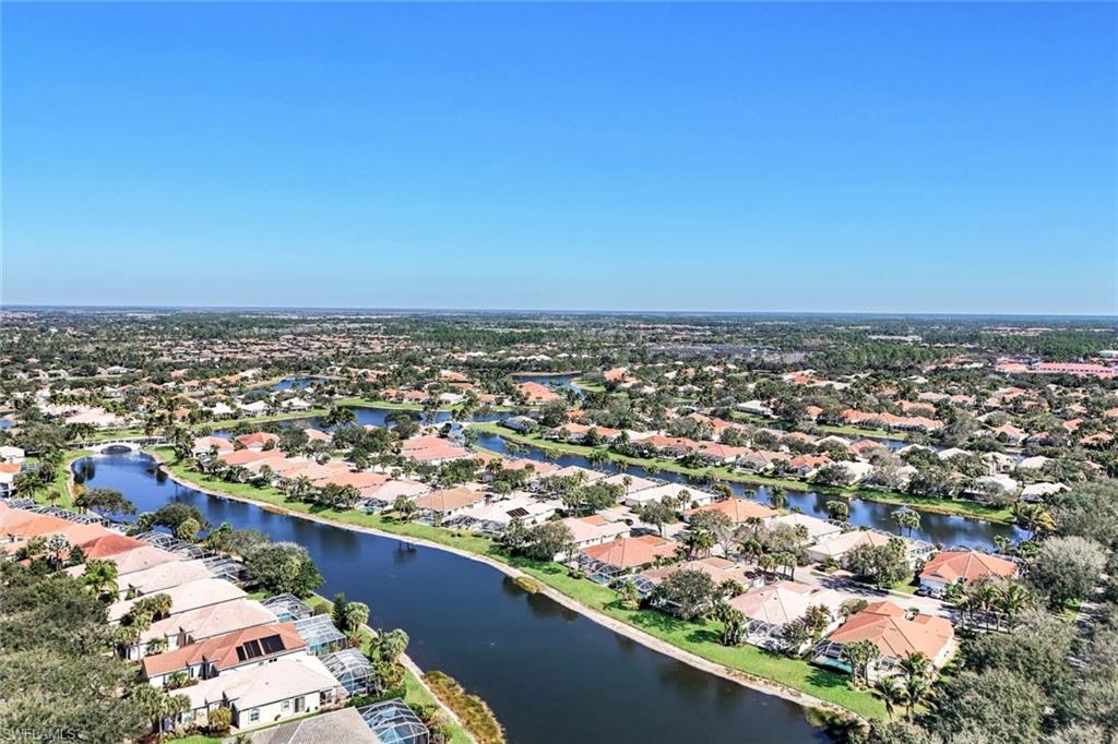 3025 Futuna Lane Naples, FL 34119 - Photo 28 of 46 Aerial view of residential area featuring a nearby body of water
