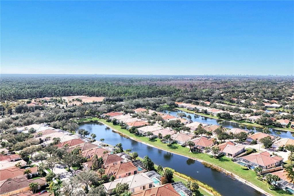3025 Futuna Lane Naples, FL 34119 - Photo 29 of 46 Aerial view of residential area with a large body of water