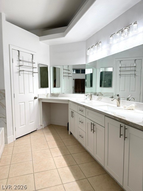 804 Rancho Coast Way Henderson, NV 89002 - Photo 12 of 20 A spacious double vanity and tile flooring define this bright primary bathroom.
