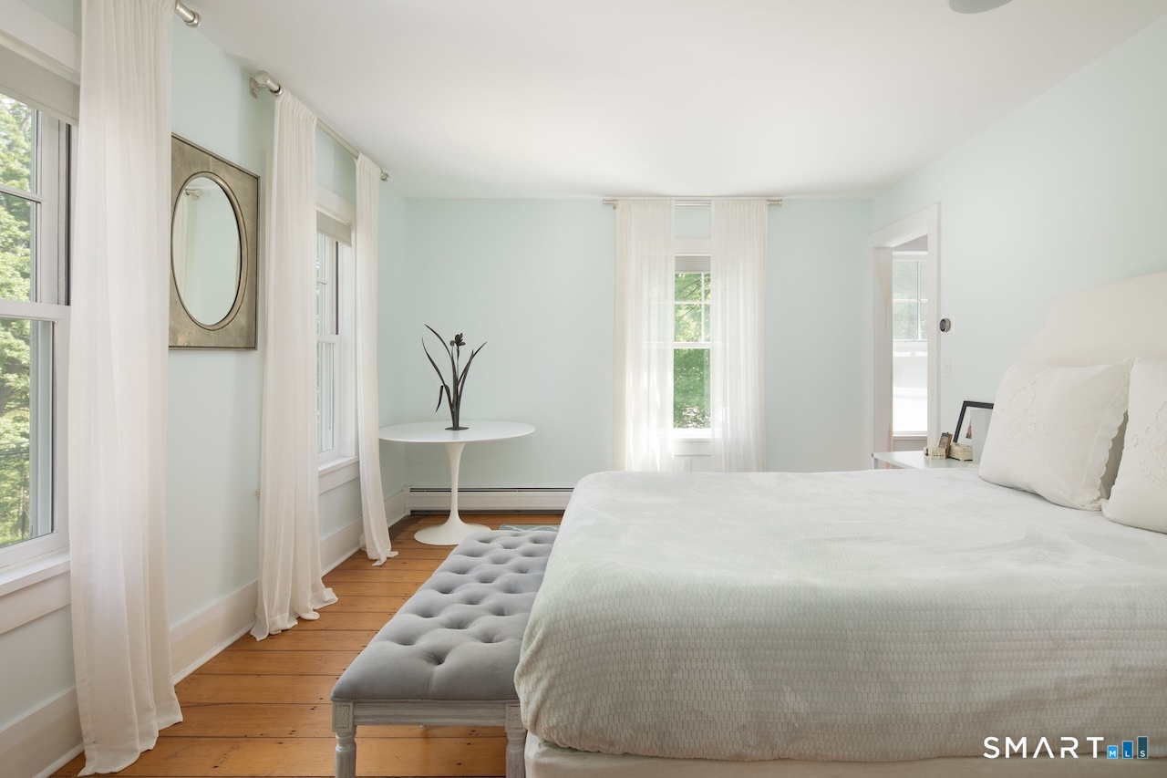 329 Housatonic River Road Salisbury, CT 06031 - Photo 27 of 32 a bedroom with a bed and a window
