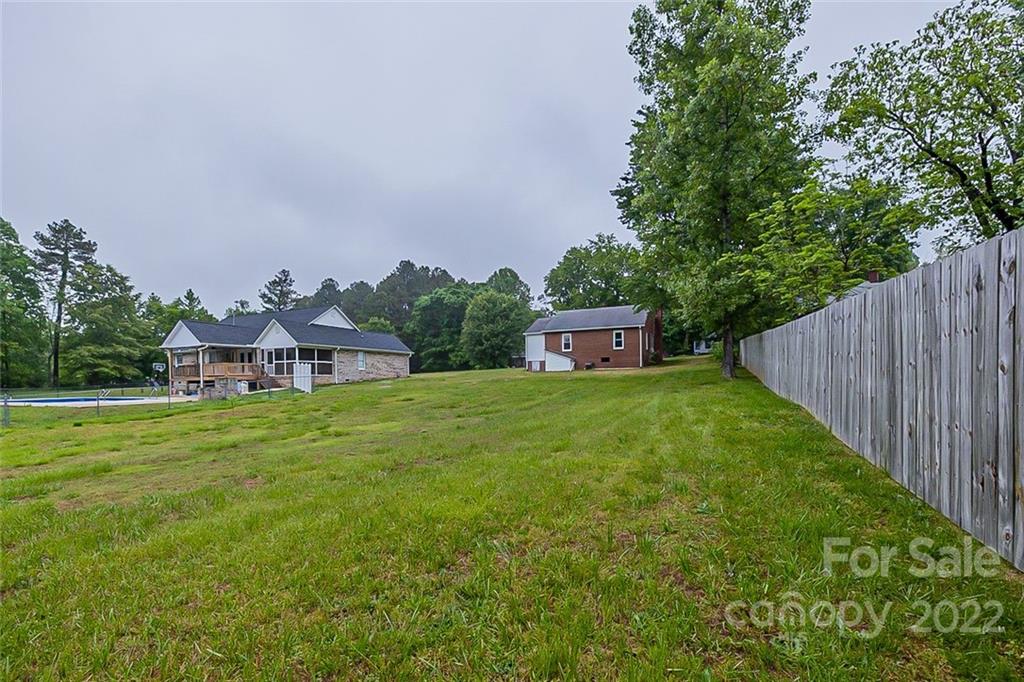 621 Rowan Mill Road Salisbury, NC 28147 - Photo 12 of 13 a front view of a house with garden