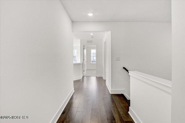 179 Woolley Court, Unit 1 Asbury Park, NJ 07712 - Photo 12 of 24 a view of a hallway with wooden floor