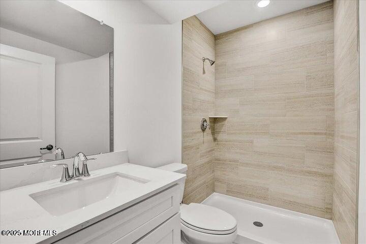 179 Woolley Court, Unit 1 Asbury Park, NJ 07712 - Photo 14 of 24 a bathroom with a sink a toilet and shower