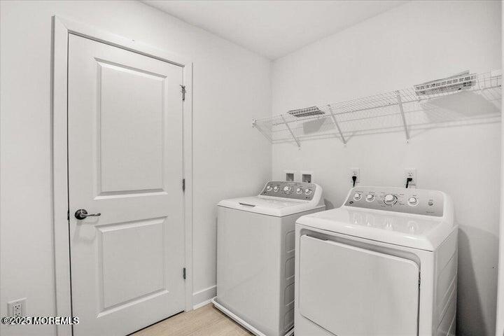 179 Woolley Court, Unit 1 Asbury Park, NJ 07712 - Photo 17 of 24 a utility room with dryer and washer