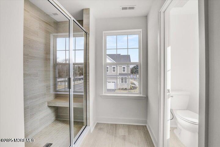 179 Woolley Court, Unit 1 Asbury Park, NJ 07712 - Photo 21 of 24 a view of an empty room with a window