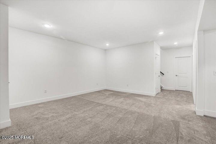 179 Woolley Court, Unit 1 Asbury Park, NJ 07712 - Photo 24 of 24 an empty room with white wall and tiles