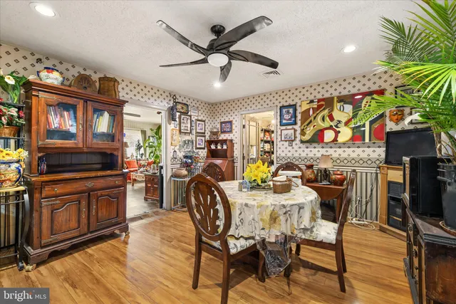 a living room with furniture and flowers