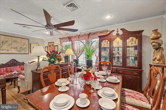 a very nice looking dining room with furniture and a kitchen