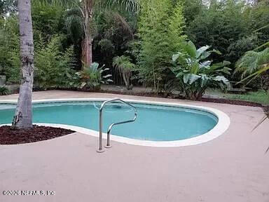 543 Ray Edwards Road St. Augustine, FL 32086 - Photo 19 of 19 a view of a swimming pool with a yard
