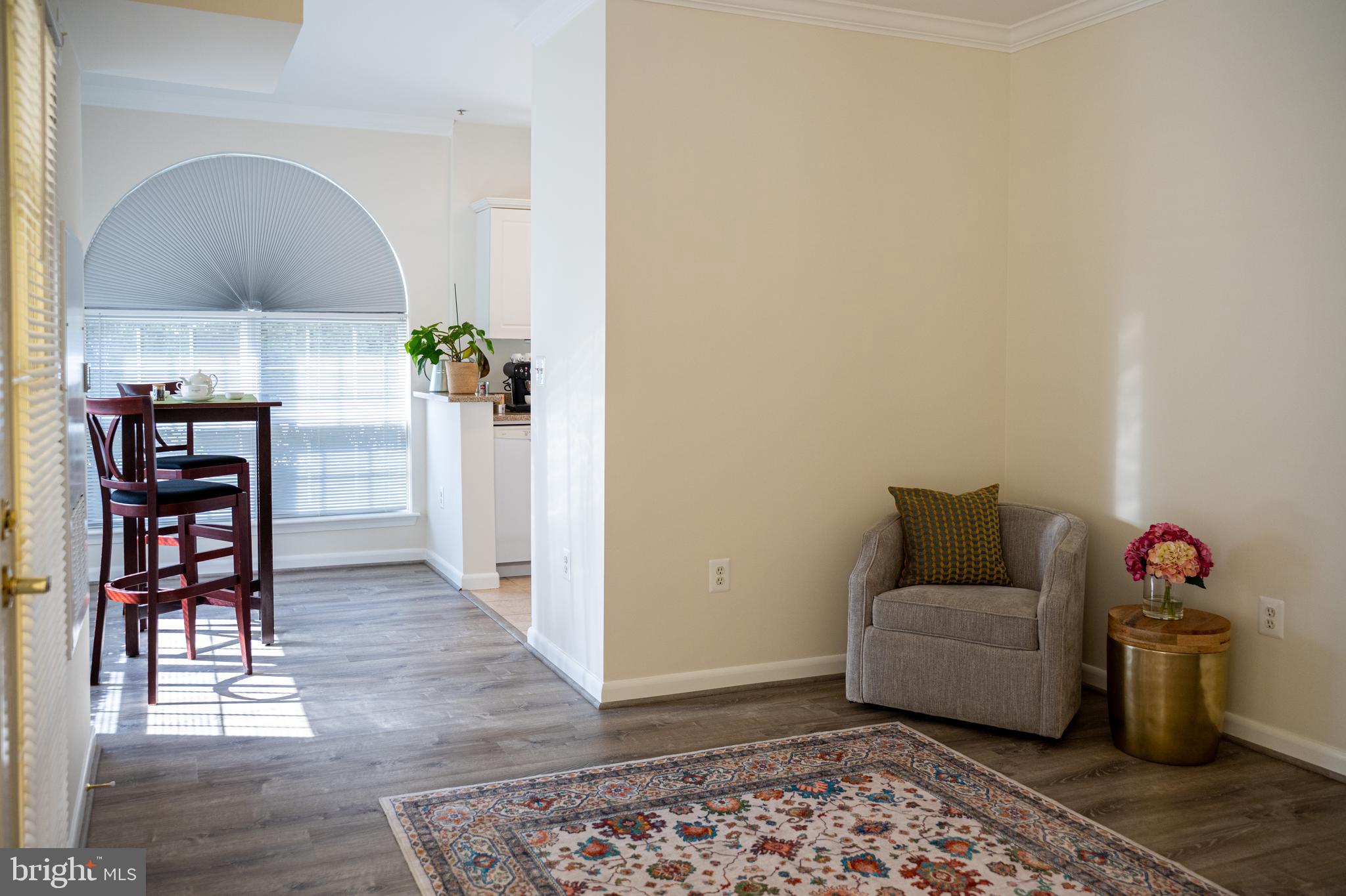 4561 Strutfield Lane, Unit 3115 Alexandria, VA 22311 - Photo 14 of 36 a living room with furniture and a wooden floor