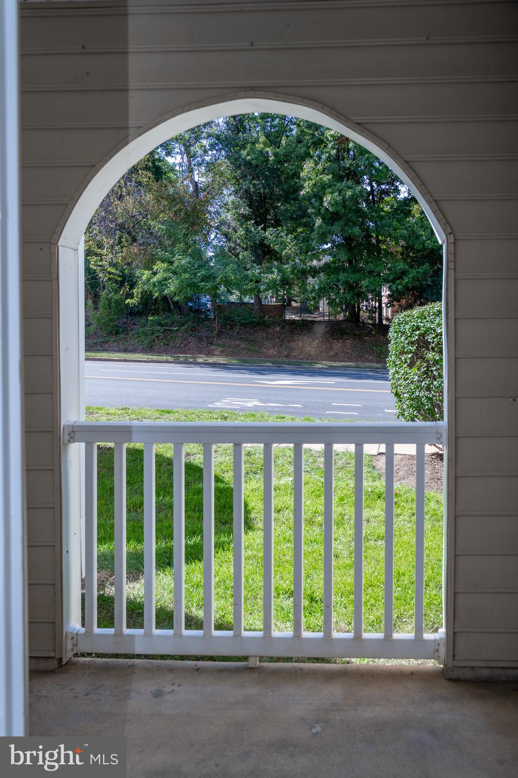 4561 Strutfield Lane, Unit 3115 Alexandria, VA 22311 - Photo 24 of 36 a view of porch with a yard