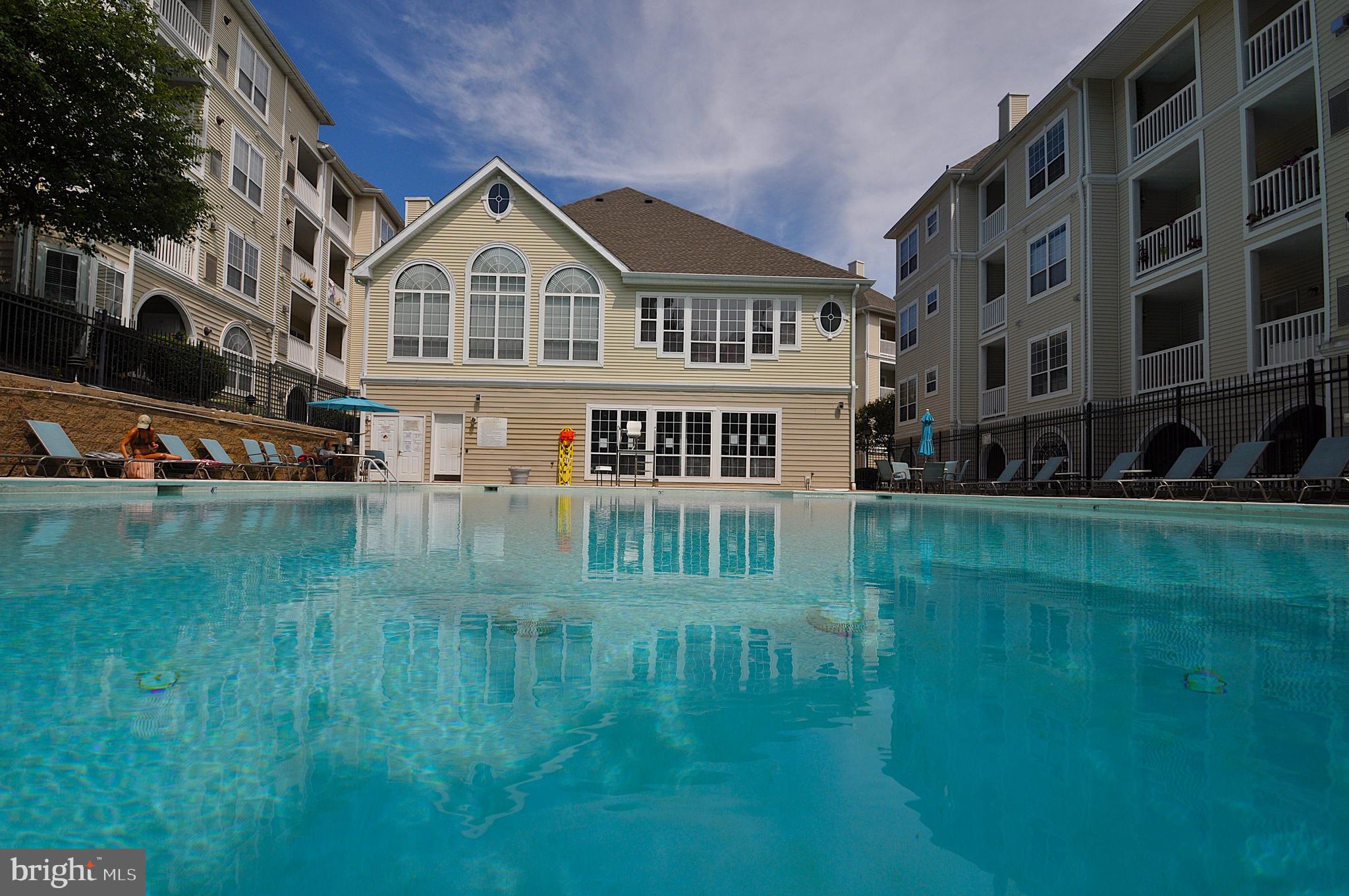 4561 Strutfield Lane, Unit 3115 Alexandria, VA 22311 - Photo 28 of 36 a front view of a house with a yard