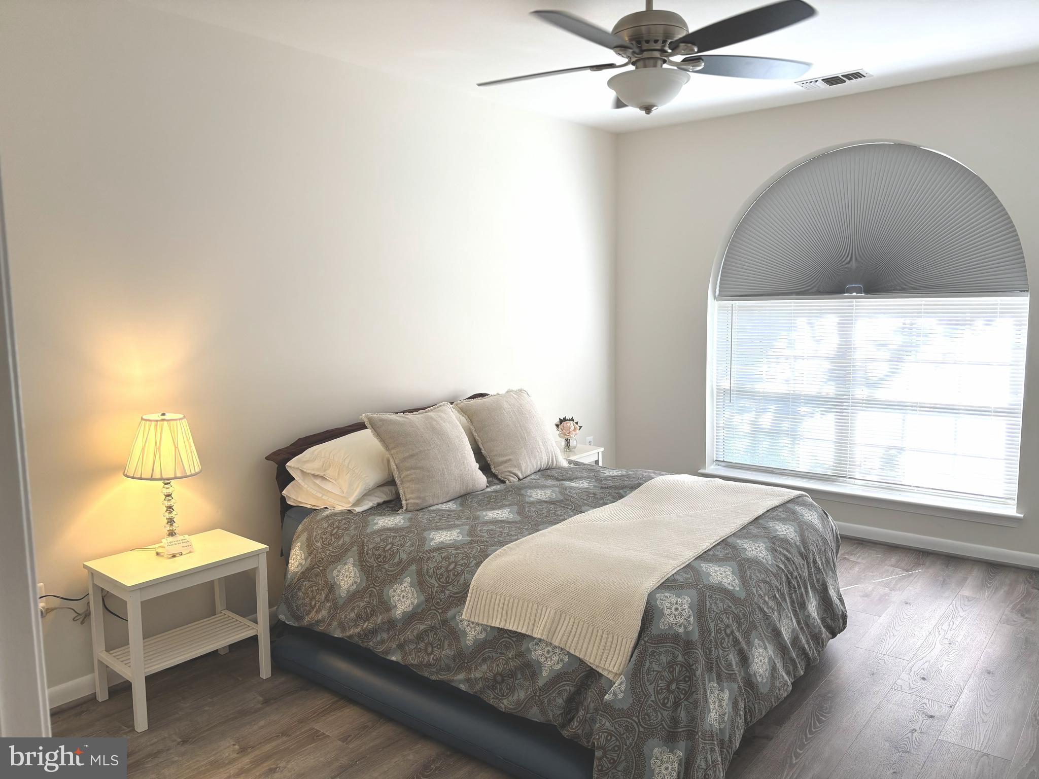 4561 Strutfield Lane, Unit 3115 Alexandria, VA 22311 - Photo 4 of 36 a bedroom with a bed and window