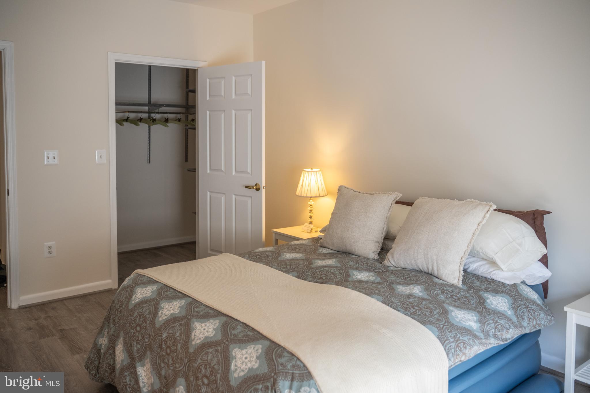 4561 Strutfield Lane, Unit 3115 Alexandria, VA 22311 - Photo 5 of 36 a bed room with a bed and a table