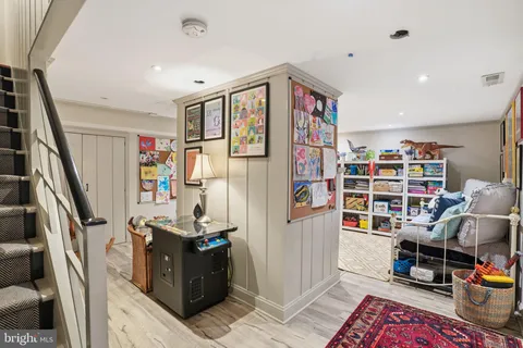 a view of a workspace with furniture and toys