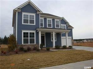 1724 Ridgehaven Road, Unit 220 Waxhaw, NC 28173 - Photo 1 of 16 a front view of a house with garden
