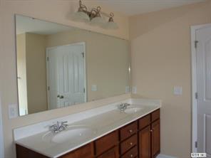 1724 Ridgehaven Road, Unit 220 Waxhaw, NC 28173 - Photo 9 of 16 a bathroom with a sink and a mirror