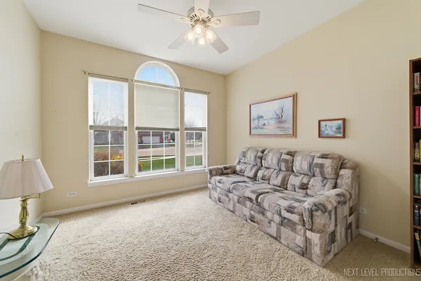a living room with furniture and a large window