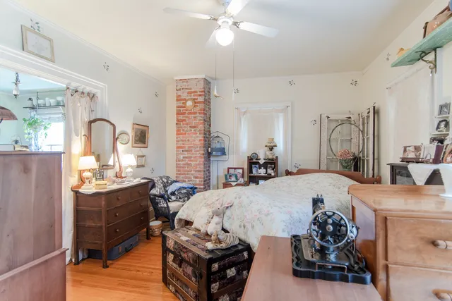 a bedroom with a bed and dresser