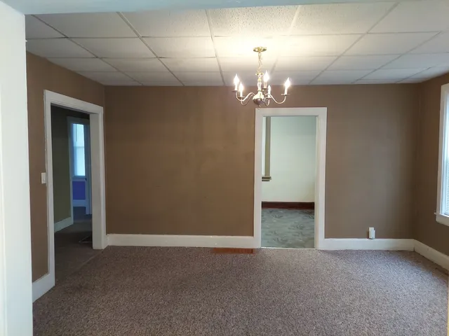 an empty room with a bathroom